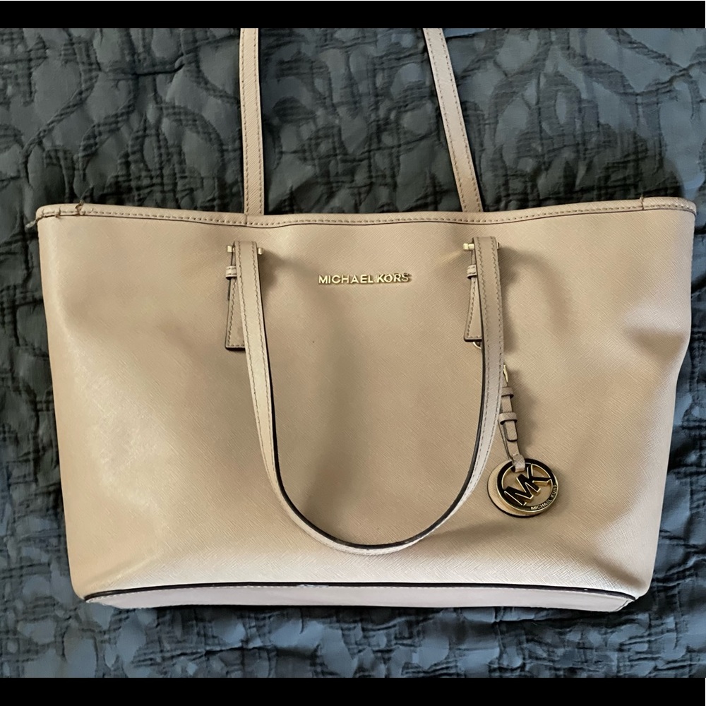 Large tan leather Michael Kors tote comes with a duster bag